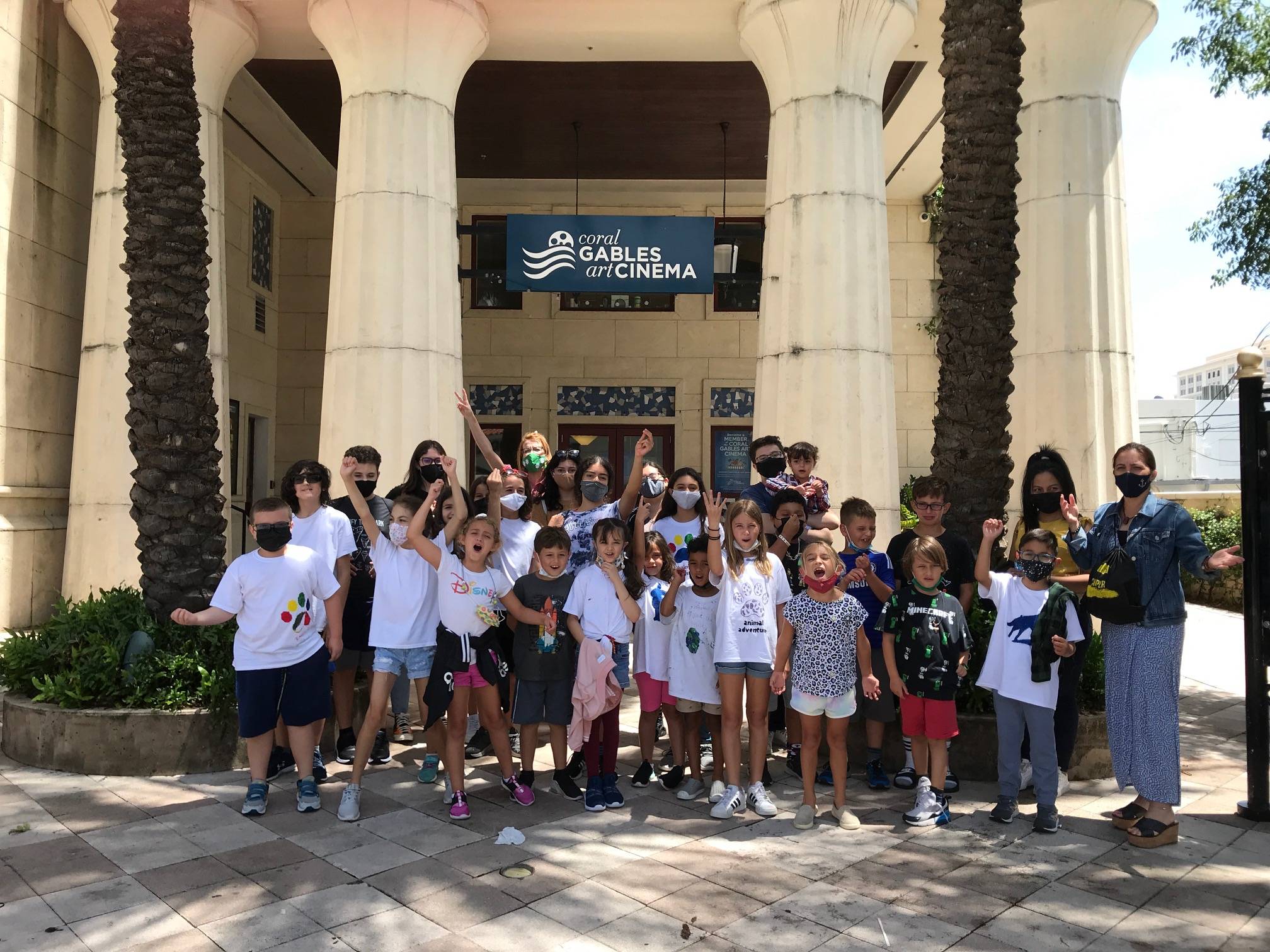 Children standing in front of Coral Gables Art Cinema